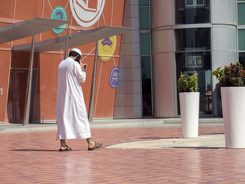How should you greet the locals in the UAE and Dubai
